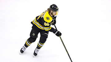 TORONTO, ONTARIO - AUGUST 19: David Pastrnak #88 of the Boston Bruins carries the puck against the Carolina Hurricanes during the second period in Game Five of the Eastern Conference First Round during the 2020 NHL Stanley Cup Playoffs at Scotiabank Arena on August 19, 2020 in Toronto, Ontario. (Photo by Elsa/Getty Images)