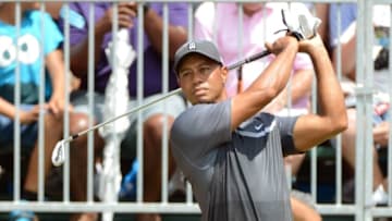 Aug 21, 2015; Greensboro, NC, USA; Tiger Woods takes a practice swing on the first tee during the second round of the Wyndham Championship golf tournament at Sedgefield Country Club. Mandatory Credit: Rob Kinnan-USA TODAY Sports