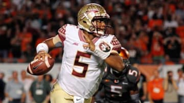 Nov 15, 2014; Miami Gardens, FL, USA; Florida State Seminoles quarterback Jameis Winston (5) runs out of the pocket against the Miami Hurricanes in the first half at Sun Life Stadium. Mandatory Credit: David Manning-USA TODAY Sports