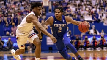 LAWRENCE, KS - JANUARY 29: Sahvir Wheeler #2 of the Kentucky Wildcats drives past Joseph Yesufu #1 of the Kansas Jayhawks in the second half at Allen Fieldhouse on January 29, 2022 in Lawrence, Kansas. (Photo by Kyle Rivas/Getty Images)