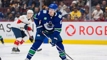 Dec 1, 2022; Vancouver, British Columbia, CAN; Vancouver Canucks defenseman Riley Stillman (61) handles the puck against the Florida Panthers in the first period at Rogers Arena. Mandatory Credit: Bob Frid-USA TODAY Sports