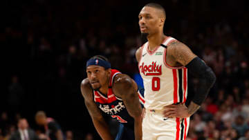 Mar 4, 2020; Portland, Oregon, USA; Portland Trail Blazers guard Damian Lillard (0) and Washington Wizards guard Bradley Beal (3) wait during a break in the action during the second half at Moda Center. The Trail Blazers won 125-105. Mandatory Credit: Troy Wayrynen-USA TODAY Sports