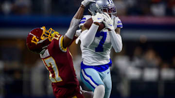 Dec 26, 2021; Arlington, Texas, USA; Dallas Cowboys cornerback Trevon Diggs (7) intercepts a pass intended for Washington Football Team wide receiver Terry McLaurin (17) during the first quarter at AT&T Stadium. Mandatory Credit: Jerome Miron-USA TODAY Sports