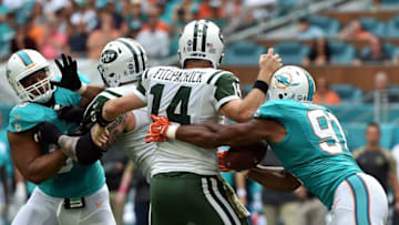 Nov 6, 2016; Miami Gardens, FL, USA; Miami Dolphins defensive end Cameron Wake (91) causes a fumble from New York Jets quarterback Ryan Fitzpatrick (14) during the first half at Hard Rock Stadium. Mandatory Credit: Steve Mitchell-USA TODAY Sports