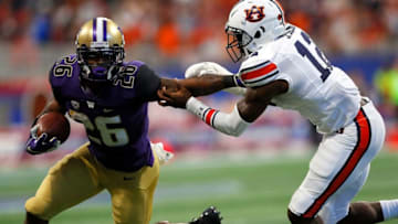 Auburn's Jamel Dean drags down Washington's Salvon Ahmed during the Week 1 matchup in Atlanta. (Photo by Kevin C. Cox/Getty Images)