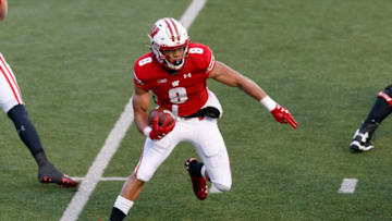 Dec 5, 2020; Madison, Wisconsin, USA; Wisconsin Badgers running back Jalen Berger (8) rushes with the football during the second quarter against the Indiana Hoosiers at Camp Randall Stadium. Mandatory Credit: Jeff Hanisch-USA TODAY Sports