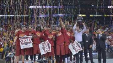 Mar 14, 2015; Kansas City, MO, USA; The Iowa State Cyclones with head coach Fred Holberg raise the championship trophy after the game against the Kansas Jayhawks in the championship game of the Big 12 tournament at Sprint Center. Iowa State Cyclones won 70-66. Mandatory Credit: Denny Medley-USA TODAY Sports