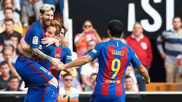 VALENCIA, SPAIN - OCTOBER 22: Lionel Messi of Barcelona celebrates scoring his team's first goal with his teammates Ivan Rakitic and Luis Suarez during the La Liga match between Valencia CF and FC Barcelona at Mestalla Stadium on October 22, 2016 in Valencia, Spain. (Photo by Manuel Queimadelos Alonso/Getty Images)