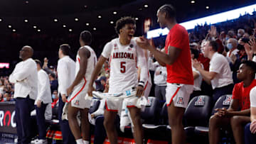 Feb 3, 2022; Tucson, Arizona, USA; Arizona Wildcats guard Justin Kier (5) reacts on the bench after a basket during the second half against the UCLA Bruins at McKale Center. Mandatory Credit: Chris Coduto-USA TODAY Sports