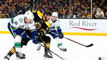 BOSTON, MA - FEBRUARY 04: Sean Kuraly #52 of the Boston Bruins battles for the puck during a game against the Vancouver Canucks at TD Garden on February 4, 2020 in Boston, Massachusetts. (Photo by Adam Glanzman/Getty Images)