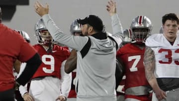 Mar 7, 2023; Columbus, Ohio, USA; Ohio State Buckeyes head coach Ryan Day gathers his team for a huddle at the start of spring football drills at the Woody Hayes Athletic Center. Mandatory Credit: Adam Cairns-The Columbus DispatchFootball Ohio State Buckeyes Football