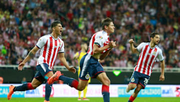 ZAPOPAN, MEXICO - MARCH 03: Jesus Godinez (C) of Chivas celebrates after scoring the first goal of his team during the 10th round match between Chivas and America as part of the Torneo Clausura 2018 Liga MX at Akron Stadium on March 03, 2018 in Zapopan, Mexico. (Photo by Juan Mejia/Jam Media/Getty Images)