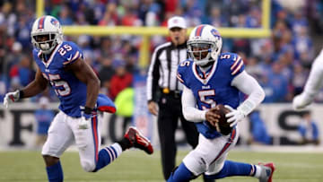 Dec 6, 2015; Orchard Park, NY, USA; Buffalo Bills running back LeSean McCoy (25) looks on as quarterback Tyrod Taylor (5) runs the ball during the second half against the Houston Texans at Ralph Wilson Stadium. Buffalo beat Houston 30-21. Mandatory Credit: Timothy T. Ludwig-USA TODAY Sports