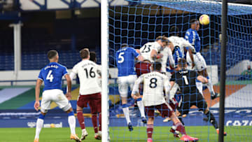 LIVERPOOL, ENGLAND - DECEMBER 19: Yerry Mina of Everton scores his sides second goal during the Premier League match between Everton and Arsenal at Goodison Park on December 19, 2020 in Liverpool, England. A limited number of fans (2000) are welcomed back to stadiums to watch elite football across England. This was following easing of restrictions on spectators in tiers one and two areas only. (Photo by Peter Powell -