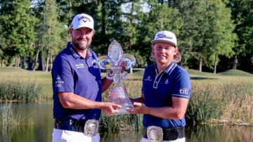 Apr 25, 2021; Avondale, Louisiana, USA; Cameron Smith and Marc Leishman hold up the Zurich Classic trophy and belts after winning the final round round of the Zurich Classic of New Orleans golf tournament. Mandatory Credit: Stephen Lew-USA TODAY Sports
