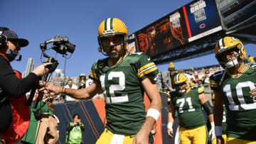 CHICAGO, ILLINOIS - OCTOBER 17: Aaron Rodgers #12 and Jordan Love #10 of the Green Bay Packers take the field before a game against the Chicago Bears at Soldier Field on October 17, 2021 in Chicago, Illinois. (Photo by Quinn Harris/Getty Images)