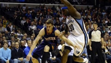 Jan 10, 2014; Memphis, TN, USA; Phoenix Suns shooting guard Goran Dragic (1) drives to the basket against Memphis Grizzlies power forward Zach Randolph (50) during the fourth quarter at FedExForum. Memphis Grizzlies beat the Phoenix Suns 104 - 99. Mandatory Credit: Justin Ford-USA TODAY Sports