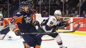 WINDSOR, ON - DECEMBER 03: Defenceman Fedor Gordeev #15 of the Flint Firebirds skates against forward Kirill Kozhevnikov #88 of the Windsor Spitfires on December 3, 2017 at the WFCU Centre in Windsor, Ontario, Canada. (Photo by Dennis Pajot/Getty Images)