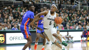 EAST LANSING, MI - DECEMBER 31: Cassius Winston #5 of the Michigan State Spartans drives to the basket against Zach Sellers #3 of the Savannah State Tigers at Breslin Center on December 31, 2017 in East Lansing, Michigan. (Photo by Rey Del Rio/Getty Images)