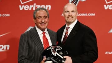 Feb 3, 2015; Flowery Branch, GA, USA; Atlanta Falcons team owner Arthur Blank (left) and new head coach Dan Quinn pose for a photo during a press conference at the Falcons Training Facility. Mandatory Credit: Dale Zanine-USA TODAY Sports