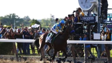 Jun 6, 2015; Elmont, NY, USA; Victor Espinoza aboard American Pharoah (5) wins the 2015 Belmont Stakes and the Triple Crown at Belmont Park. Mandatory Credit: Winslow Townson-USA TODAY Sports