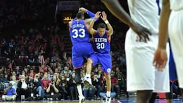 Feb 7, 2015; Philadelphia, PA, USA; Philadelphia 76ers forward Robert Covington (33) celebrates a three point shot with 76ers guard Tim Frazier (20) during the fourth quarter of the game at the Wells Fargo Center. The Sixers beat the Hornets 89-81. Mandatory Credit: John Geliebter-USA TODAY Sports