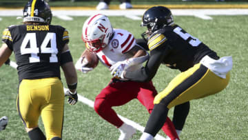 IOWA CITY, IOWA- NOVEMBER 27: Defensive tackle Daviyon Nixon #54 of the Iowa Hawkeyes makes a tackle during the first half against wide receiver Wan'Dale Robinson #1 of the Nebraska Cornhuskers at Kinnick Stadium on November 27, 2020 in Iowa City, Iowa. (Photo by Matthew Holst/Getty Images)