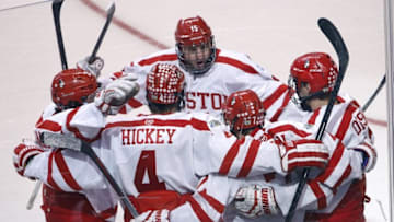 Apr 11, 2015; Boston, MA, USA; The Boston University Terriers surround forward Cason Hohmann (7) after his goal against the Providence College Friars during the second period in the championship game of the Frozen Four college ice hockey tournament at TD Garden. Mandatory Credit: Greg M. Cooper-USA TODAY Sports