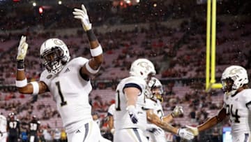 LOUISVILLE, KY - OCTOBER 05: Qua Searcy #1 of the Georgia Tech Yellow Jackets celebrates after a touchdown run by Jordan Mason #24 in the first quarter of the game against the Louisville Cardinals at Cardinal Stadium on October 05, 2018 in Louisville, Kentucky. (Photo by Joe Robbins/Getty Images)