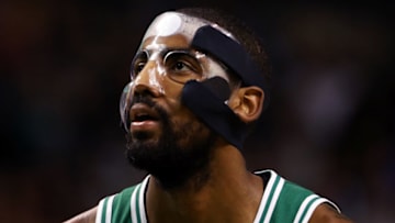 BOSTON, MA - NOVEMBER 16: Kyrie Irving #11 of the Boston Celtics, wearing a mask due to a facial fracture, looks on during the first quarter against the Golden State Warriors at TD Garden on November 16, 2017 in Boston, Massachusetts. (Photo by Maddie Meyer/Getty Images)