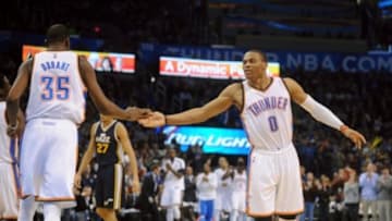 Jan 9, 2015; Oklahoma City, OK, USA; Oklahoma City Thunder guard Russell Westbrook (0) congratulates Oklahoma City Thunder forward Kevin Durant (35) after a play against the Utah Jazz at Chesapeake Energy Arena. Mandatory Credit: Mark D. Smith-USA TODAY Sports
