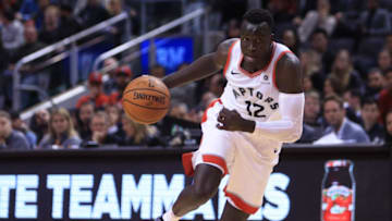 TORONTO, ON - OCTOBER 5: Deng Adel #12 of the Toronto Raptors dribbles the ball during the second half of an NBA preseason game against of Melbourne United at Scotiabank Arena on October 5, 2018 in Toronto, Canada. NOTE TO USER: User expressly acknowledges and agrees that, by downloading and or using this photograph, User is consenting to the terms and conditions of the Getty Images License Agreement. (Photo by Vaughn Ridley/Getty Images)