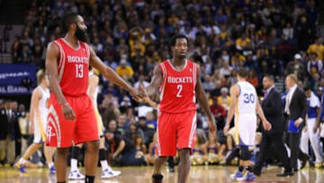 Dec 13, 2013; Oakland, CA, USA; Houston Rockets point guard Patrick Beverley (2) high fives shooting guard James Harden (13) as a timeout is called against the Golden State Warriors after a three point basket during the fourth quarter at Oracle Arena. The Houston Rockets defeated the Golden State Warriors 116-112. Mandatory Credit: Kelley L Cox-USA TODAY Sports