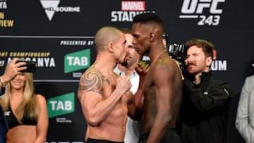 MELBOURNE, AUSTRALIA - OCTOBER 05: (L-R) Robert Whittaker of New Zealand and Israel Adesanya of New Zealand face off during the UFC 243 weigh-in at Marvel Stadium on October 05, 2019 in Melbourne, Australia. (Photo by Jeff Bottari/Zuffa LLC/Zuffa LLC via Getty Images)