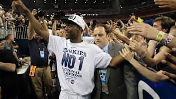 HOUSTON, TX - APRIL 04: Kemba Walker #15 of the Connecticut Huskies walks off the court after defeating the Butler Bulldogs to win the National Championship Game of the 2011 NCAA Division I Men's Basketball Tournament by a score of 53-41 at Reliant Stadium on April 4, 2011 in Houston, Texas. (Photo by Streeter Lecka/Getty Images)