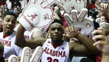 Feb 10, 2016; Tuscaloosa, AL, USA; Alabama Crimson Tide guard Retin Obasohan (32) celebrates with the fans after his team defeated the Aggies 63-62 at Coleman Coliseum. Mandatory Credit: Marvin Gentry-USA TODAY Sports