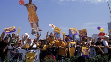 21 Jun 2000: A view of fans as they hold up a Shaquille O''Neal sign in front of the Staples Center during the Laker's Victory Parade in Los Angeles, California. NOTE TO USER: It is expressly understood that the only rights Allsport are offering to license in this Photograph are one-time, non-exclusive editorial rights. No advertising or commercial uses of any kind may be made of Allsport photos. User acknowledges that it is aware that Allsport is an editorial sports agency and that NO RELEASES OF ANY TYPE ARE OBTAINED from the subjects contained in the photographs.Mandatory Credit: Ezra O. Shaw /Allsport