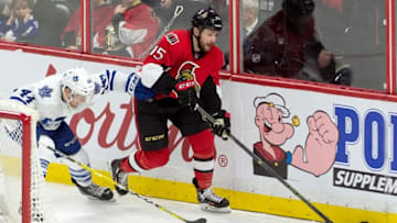Mar 12, 2016; Ottawa, Ontario, CAN; Ottawa Senators center Zack Smith (15) skates with the puck in front of Toronto Maple Leafs defenseman Morgan Rielly (44) in the third period at the Canadian Tire Centre. The Senators defeated the Maple Leafs 4-0. Mandatory Credit: Marc DesRosiers-USA TODAY Sports