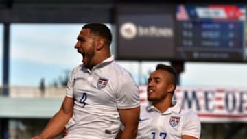 Oct 3, 2015; Kansas City, MO, USA; USA defender Cameron Carter-Vickers (4) celebrates with teammate Jerome Kiesewetter (17) after scoring against Cuba during the first half at Sporting Park. Mandatory Credit: Peter G. Aiken-USA TODAY Sports