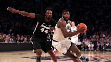 NEW YORK, NEW YORK - MARCH 14: Eric Paschall #4 of the Villanova Wildcats drives to the basket against Isaiah Jackson #44 of the Providence Friars in the second half during the Quarterfinals of the 2019 Big East men's basketball tournament at Madison Square Garden on March 14, 2019 in New York City. (Photo by Mike Lawrie/Getty Images)
