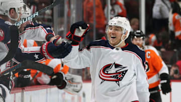 PHILADELPHIA, PA - MARCH 15: Cam Atkinson #13 of the Columbus Blue Jackets celebrates his third period empty-net goal against the Philadelphia Flyers with his teammates on the bench on March 15, 2018 at the Wells Fargo Center in Philadelphia, Pennsylvania. The goal was his third of the game. The Blue Jackets went on to defeat the Flyers 5-3. (Photo by Len Redkoles/NHLI via Getty Images)