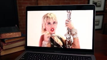 NEW YORK, NY - AUGUST 30: In this photo illustration, Miley Cyrus, viewed on a laptop, performs during the 2020 MTV Video Music Awards broadcast on August 30, 2020 in New York City. (Photo Illustration by Frazer Harrison/Getty Images)