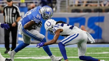 Detroit Lions tight end Alize Mack (84) is tackled by Indianapolis Colts cornerback Marvell Tell III (39) during the second half of a preseason game at Ford Field in Detroit on Friday, Aug. 27, 2021.