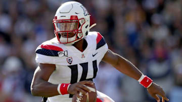 BOULDER, COLORADO - OCTOBER 05: Quarterback Khalil Tate #14 of the Arizona Wildcats rolls out of the pocket against the Colorado Buffaloes in the second quarter at Folsom Field on October 05, 2019 in Boulder, Colorado. (Photo by Matthew Stockman/Getty Images)