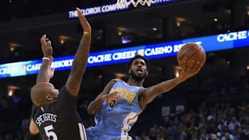 January 2, 2016; Oakland, CA, USA; Denver Nuggets forward Will Barton (5) shoots the basketball against Golden State Warriors center Marreese Speights (5) during the first quarter at Oracle Arena. Mandatory Credit: Kyle Terada-USA TODAY Sports