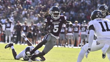 Oct 1, 2022; Starkville, Mississippi, USA; Mississippi State Bulldogs wide receiver Lideatrick Griffin (5) runs the ball while defended by Texas A&M Aggies defensive back Deuce Harmon (11) during the second quarter at Davis Wade Stadium at Scott Field. Mandatory Credit: Matt Bush-USA TODAY Sports