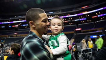 Former Duke basketball star Jayson Tatum and his son, Deuce, after a game.