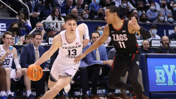 Feb 5, 2022; Provo, Utah, USA; Brigham Young Cougars guard Alex Barcello (13) dribbles past Gonzaga Bulldogs guard Nolan Hickman (11) in the second half at Marriott Center. Mandatory Credit: Rob Gray-USA TODAY Sports