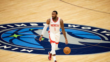 MINNEAPOLIS, MINNESOTA - MARCH 26: John Wall #1 of the Houston Rockets dribbles the ball against the Minnesota Timberwolves during the game at Target Center on March 26, 2021 in Minneapolis, Minnesota. The Timberwolves defeated the Rockets 107-101. NOTE TO USER: User expressly acknowledges and agrees that, by downloading and or using this Photograph, user is consenting to the terms and conditions of the Getty Images License Agreement (Photo by Hannah Foslien/Getty Images)