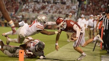 Sep 17, 2016; Norman, OK, USA; Oklahoma Sooners quarterback Baker Mayfield (6) is hit by Ohio State Buckeyes cornerback Damon Webb (7) in the fourth quarter at Gaylord Family - Oklahoma Memorial Stadium. Mandatory Credit: Mark D. Smith-USA TODAY Sports